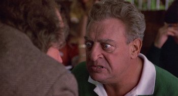 Movie still from “Back to School” (1986), directed by Alan Metter – An older man is looking angry at another man; Close Up shot, Low angle