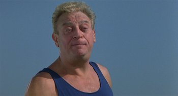 Movie still from “Back to School” (1986), directed by Alan Metter – A person wearing a tank top; Close Up shot, Low angle