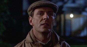 Movie still from “Back to School” (1986), directed by Alan Metter – A person wearing a hat; Close Up shot, Over the shoulder angle