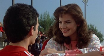 Movie still from “Back to School” (1986), directed by Alan Metter – A man and a woman are talking to each other; Close Up shot, Over the shoulder angle