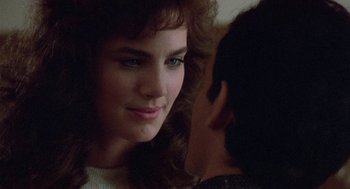 Movie still from “Back to School” (1986), directed by Alan Metter – A woman's face and a man's face; Close Up shot, Over the shoulder angle