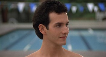 Movie still from “Back to School” (1986), directed by Alan Metter – A person wearing a shirt; Close Up shot, Low angle
