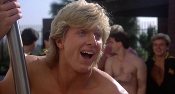 Movie still from “Back to School” (1986), directed by Alan Metter – A person with a blonde wig; Close Up shot, Low angle
