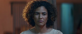 A person with curly black hair