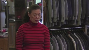 Movie still from “Jackass Presents: Bad Grandpa” (2013), directed by Jeff Tremaine – A woman in a red and black striped sweater; Medium shot, High angle