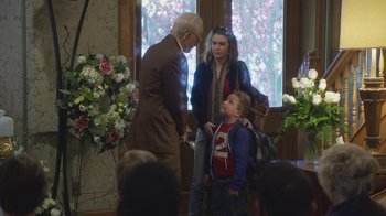 Movie still from “Jackass Presents: Bad Grandpa” (2013), directed by Jeff Tremaine – An older man and a young woman and a young boy; Medium shot, Over the shoulder angle