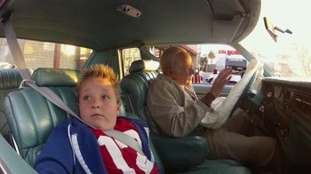 Movie still from “Jackass Presents: Bad Grandpa” (2013), directed by Jeff Tremaine – A boy and an older man in a car; Medium shot, Over the shoulder angle