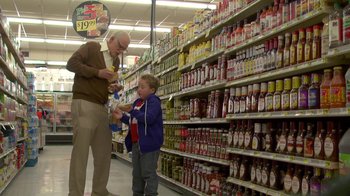 Movie still from “Jackass Presents: Bad Grandpa” (2013), directed by Jeff Tremaine – A man and a boy are in a grocery store; Medium shot, Over the shoulder angle