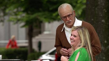 Movie still from “Jackass Presents: Bad Grandpa” (2013), directed by Jeff Tremaine – An older man and a young woman standing next to each other; Medium shot, Over the shoulder angle