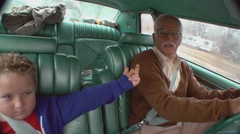 Movie still from “Jackass Presents: Bad Grandpa” (2013), directed by Jeff Tremaine – An older man and a younger man sitting in the back of a car; Medium shot, High angle