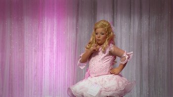 Movie still from “Jackass Presents: Bad Grandpa” (2013), directed by Jeff Tremaine – A little girl in a pink dress is posing for a picture; Wide shot, High angle