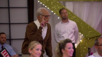 Movie still from “Jackass Presents: Bad Grandpa” (2013), directed by Jeff Tremaine – An old man standing in front of a group of people; Medium shot, Over the shoulder angle