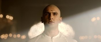 Movie still from “Bajirao Mastani” (2015), directed by Sanjay Leela Bhansali – A man with a forehead tattoo is looking at the camera; Close Up shot, Low angle