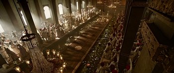 Movie still from “Bajirao Mastani” (2015), directed by Sanjay Leela Bhansali – A group of people sitting in a room with candles; Extreme Wide shot, High angle