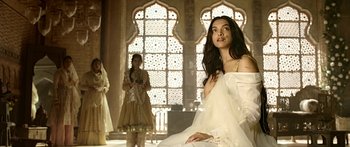 Movie still from “Bajirao Mastani” (2015), directed by Sanjay Leela Bhansali – A beautiful young woman in a white dress; Medium shot, Low angle