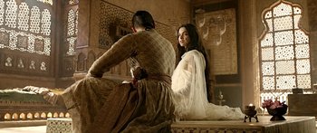 Movie still from “Bajirao Mastani” (2015), directed by Sanjay Leela Bhansali – Two women sitting on a bench in a room; Medium shot, Over the shoulder angle