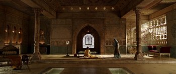 Movie still from “Bajirao Mastani” (2015), directed by Sanjay Leela Bhansali – A woman sitting on the floor of a building; Extreme Wide shot, Low angle