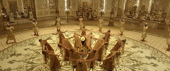 Movie still from “Bajirao Mastani” (2015), directed by Sanjay Leela Bhansali – A group of people standing in a circle in a room; Wide shot, Overhead angle