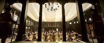 Movie still from “Bajirao Mastani” (2015), directed by Sanjay Leela Bhansali – A large group of people standing inside of a building; Extreme Wide shot, Low angle