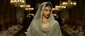 Movie still from “Bajirao Mastani” (2015), directed by Sanjay Leela Bhansali – A woman wearing a veil and a gold necklace; Close Up shot, Over the shoulder angle