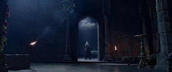 Movie still from “Bajirao Mastani” (2015), directed by Sanjay Leela Bhansali – Two people are kissing in the doorway of an old building; Wide shot, Low angle