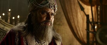Movie still from “Bajirao Mastani” (2015), directed by Sanjay Leela Bhansali – A man with long hair and a beard wearing a crown; Close Up shot, Over the shoulder angle