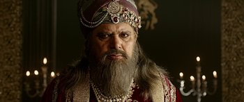 Movie still from “Bajirao Mastani” (2015), directed by Sanjay Leela Bhansali – A man with long hair and a beard wearing a crown; Close Up shot, Low angle