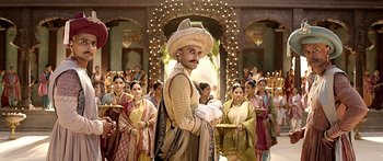 Movie still from “Bajirao Mastani” (2015), directed by Sanjay Leela Bhansali – A group of people standing in a room; Medium shot, Low angle