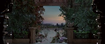 Movie still from “Bajirao Mastani” (2015), directed by Sanjay Leela Bhansali – A painting of a woman sitting on a bench by the water; Extreme Wide shot, High angle