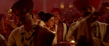 Movie still from “Bajirao Mastani” (2015), directed by Sanjay Leela Bhansali – A group of people standing in a room with candles; Close Up shot, Over the shoulder angle