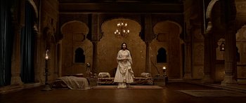 Movie still from “Bajirao Mastani” (2015), directed by Sanjay Leela Bhansali – A woman standing in front of an ornate room; Wide shot, Low angle