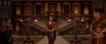 Movie still from “Bajirao Mastani” (2015), directed by Sanjay Leela Bhansali – A woman standing in front of an ornate staircase; Wide shot, High angle