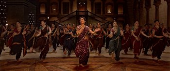 Movie still from “Bajirao Mastani” (2015), directed by Sanjay Leela Bhansali – A group of women in traditional indian garb dancing; Wide shot, High angle