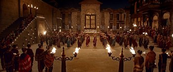 Movie still from “Bajirao Mastani” (2015), directed by Sanjay Leela Bhansali – A group of people standing around a building with torches; Extreme Wide shot, High angle