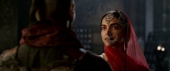 Movie still from “Bajirao Mastani” (2015), directed by Sanjay Leela Bhansali – A woman with a nose ring and a nose piercing; Close Up shot, Over the shoulder angle