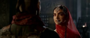 Movie still from “Bajirao Mastani” (2015), directed by Sanjay Leela Bhansali – A woman with a nose ring looking into a mirror; Close Up shot, Over the shoulder angle