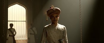 Movie still from “Bajirao Mastani” (2015), directed by Sanjay Leela Bhansali – A man wearing a hat with a feather on top; Medium shot, Over the shoulder angle