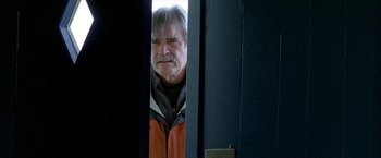 Movie still from “Ballast” (2008), directed by Lance Hammer – An older man standing in front of a door; Medium shot, Low angle