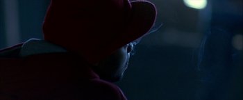 Movie still from “Ballast” (2008), directed by Lance Hammer – A man wearing a red hat and a red jacket; Extreme Close Up shot, Over the shoulder angle