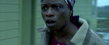 Movie still from “Ballast” (2008), directed by Lance Hammer – A person wearing a head scarf; Close Up shot, Over the shoulder angle