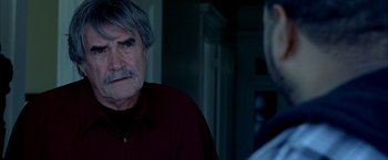Movie still from “Ballast” (2008), directed by Lance Hammer – An older man with a gray beard talking to a younger man; Close Up shot, Over the shoulder angle