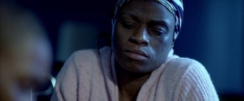 Movie still from “Ballast” (2008), directed by Lance Hammer – A person wearing a towel; Close Up shot, High angle