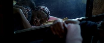 Movie still from “Ballast” (2008), directed by Lance Hammer – A woman laying on a bed with her head on a pillow; Close Up shot, Overhead angle