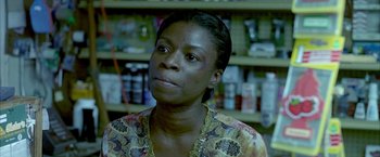 Movie still from “Ballast” (2008), directed by Lance Hammer – A person wearing a dress; Close Up shot, High angle