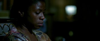 Movie still from “Ballast” (2008), directed by Lance Hammer – A person looking down at something; Close Up shot, Low angle