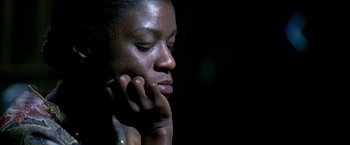 Movie still from “Ballast” (2008), directed by Lance Hammer – A person with her hand to her face; Close Up shot, High angle