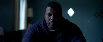 Movie still from “Ballast” (2008), directed by Lance Hammer – A person wearing a hooded sweatshirt; Close Up shot, Low angle