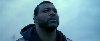 Movie still from “Ballast” (2008), directed by Lance Hammer – A person looking up at the sky; Close Up shot, Low angle