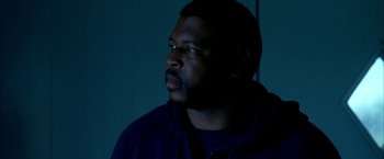 Movie still from “Ballast” (2008), directed by Lance Hammer – A man in a dark room looking up at the ceiling; Close Up shot, Low angle