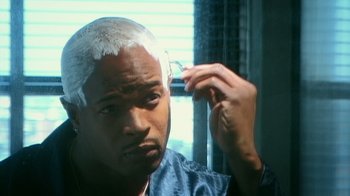 Movie still from “Bamboozled” (2000), directed by Spike Lee – A man with white hair is looking at the mirror; Close Up shot, High angle
